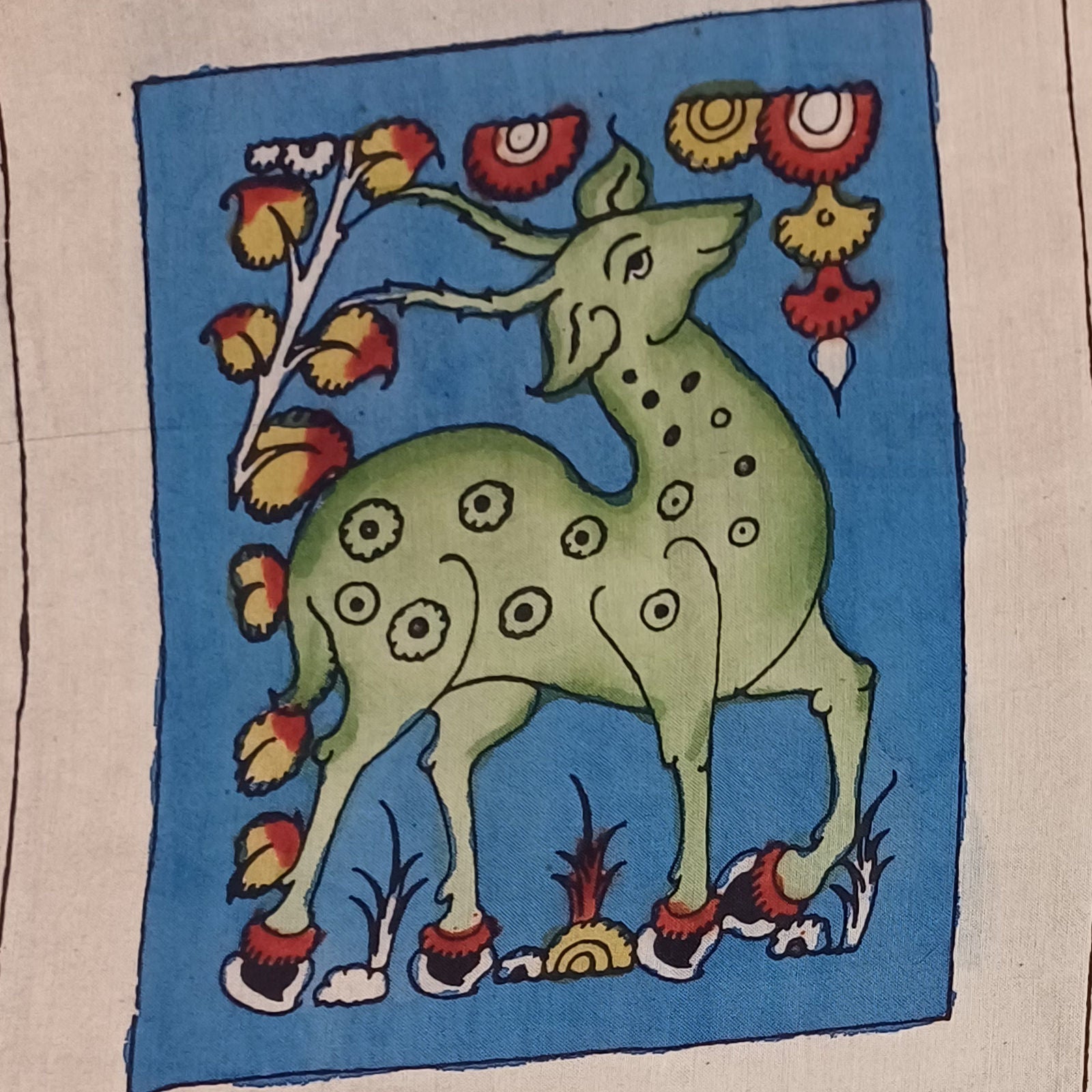Blue Kalamkari fabric piece with figurative pattern and border