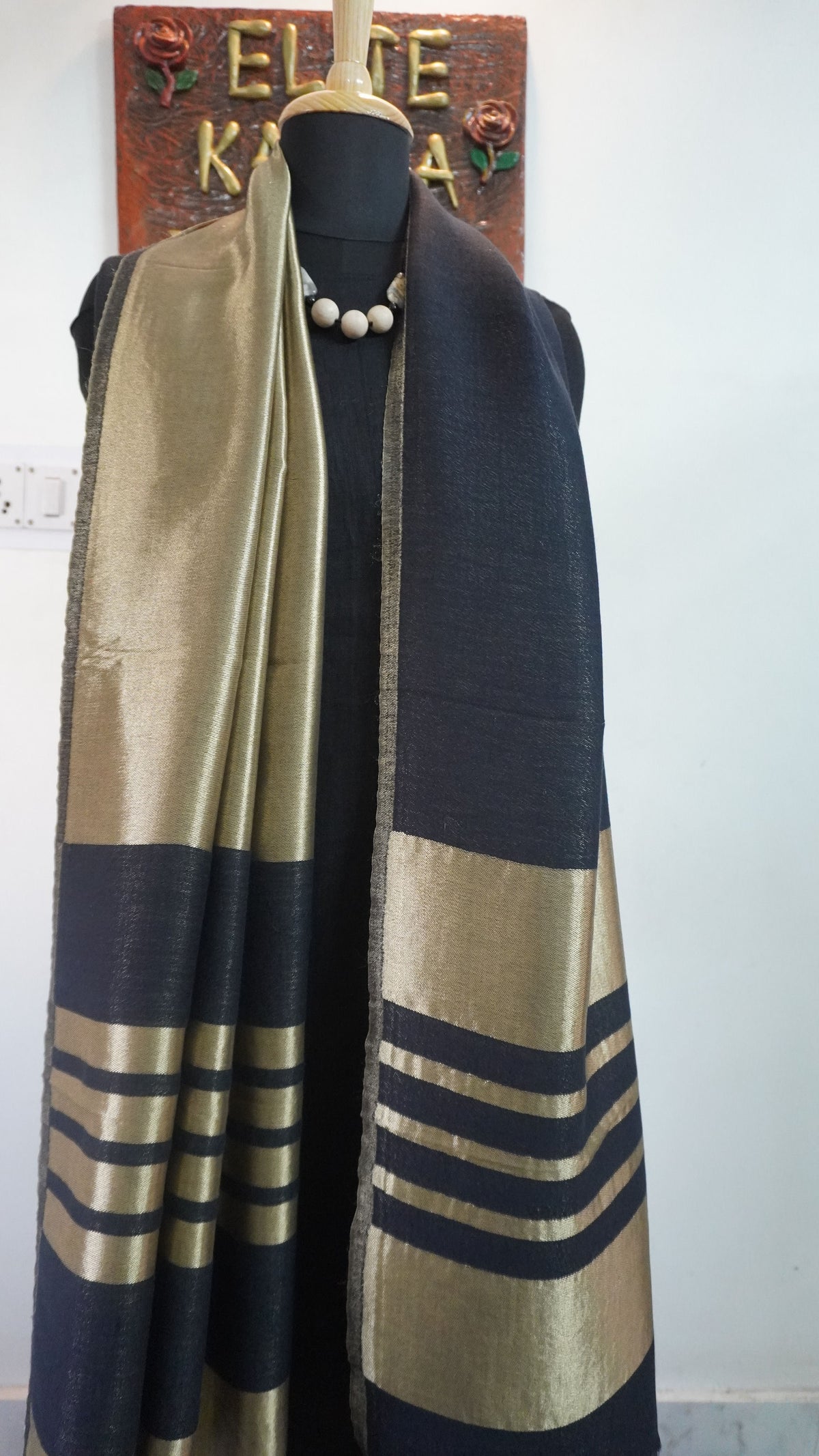 Black fine wool reversible stole with zari and striped detailing near the ends