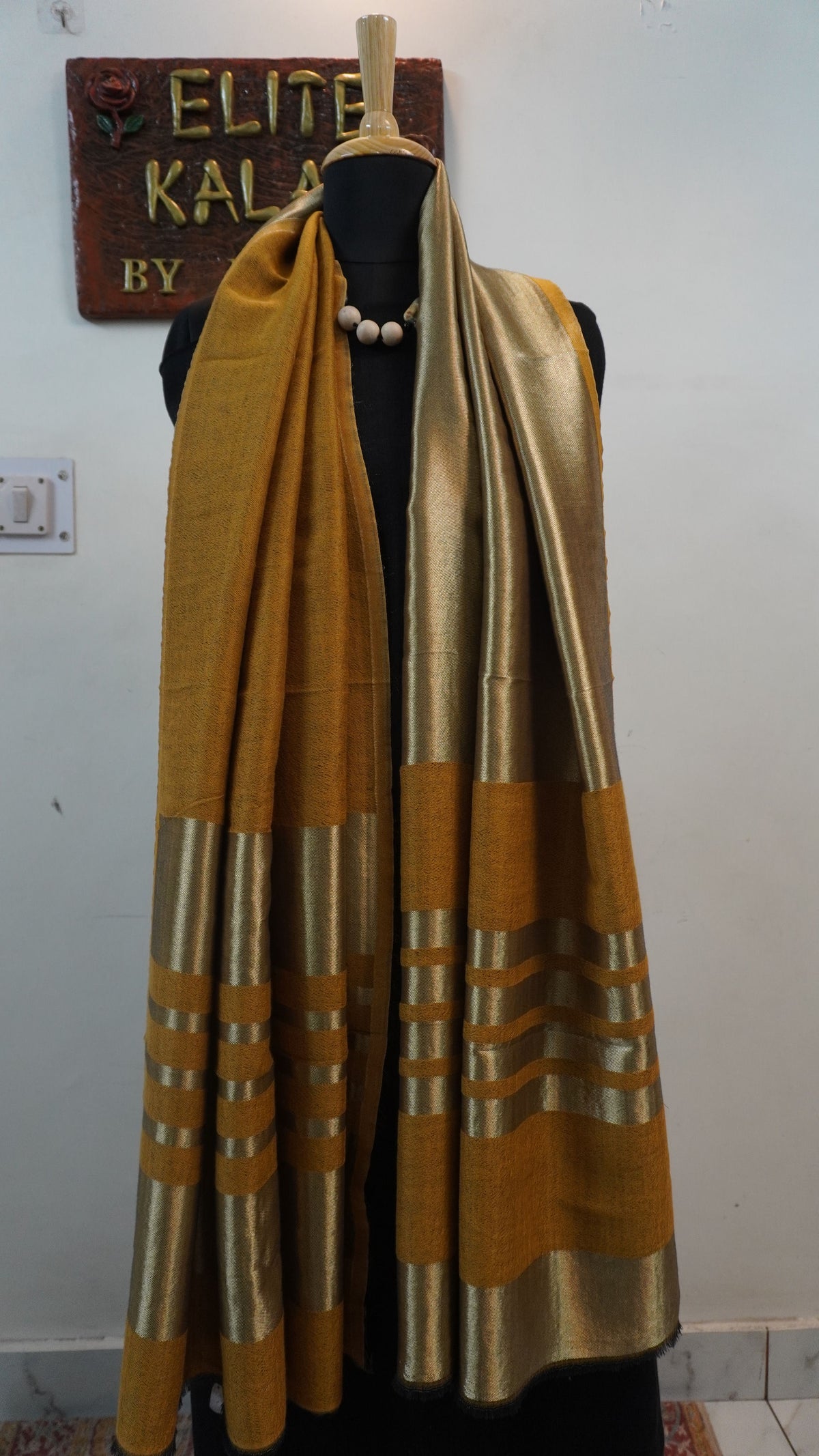 Mustard reversible fine wool stole with zari and gold striped detailing near the ends