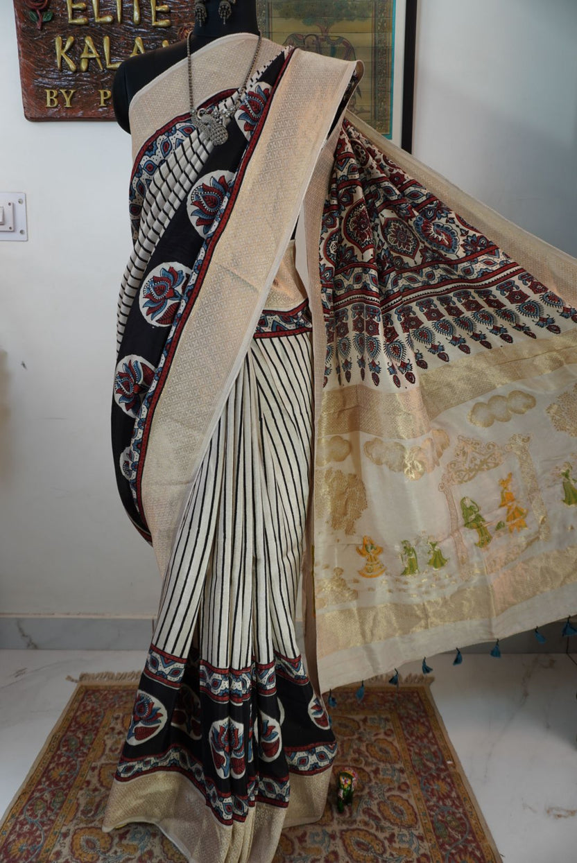 Ivory white Ajrakh Dola silk saree with multicolor stripes, lotus boota design, border and tassels