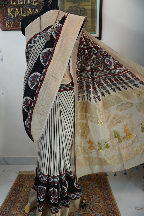 Ivory white Ajrakh Dola silk saree with multicolor stripes, lotus boota design, border and tassels