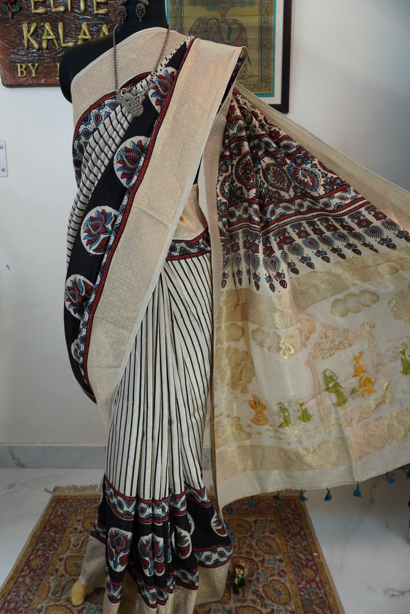 Ivory white Ajrakh Dola silk saree with multicolor stripes, lotus boota design, border and tassels