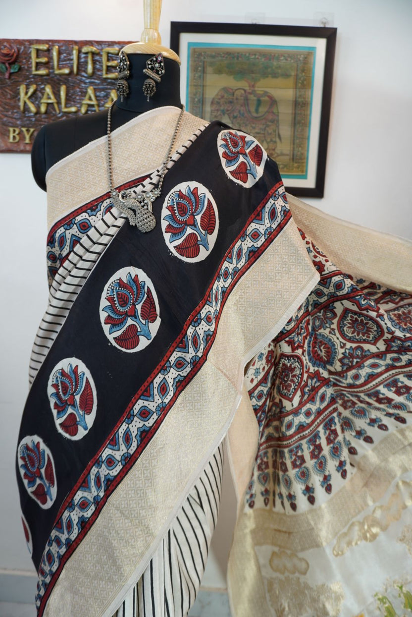 Ivory white Ajrakh Dola silk saree with multicolor stripes, lotus boota design, border and tassels