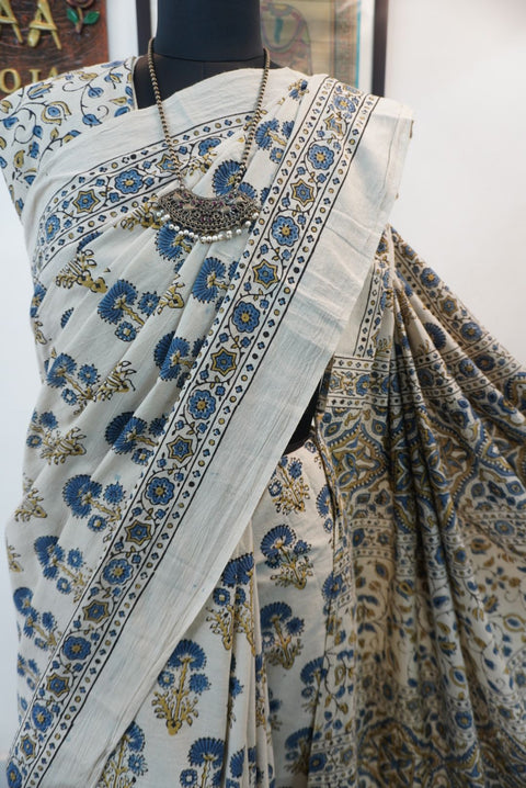 Ajrakh cotton saree in ivory with olive green and blue placement pattern, border and tassels