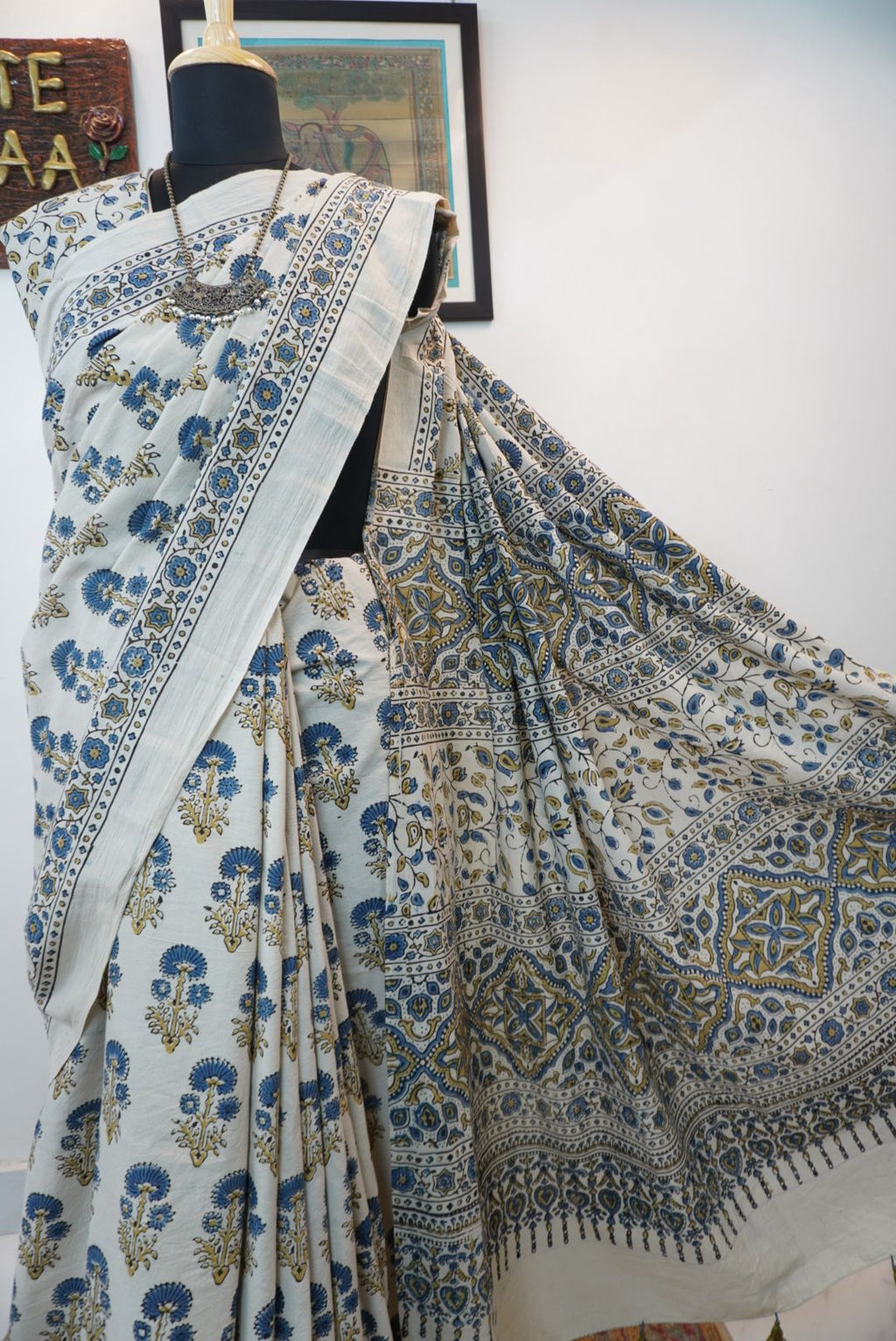 Ajrakh cotton saree in ivory with olive green and blue placement pattern, border and tassels