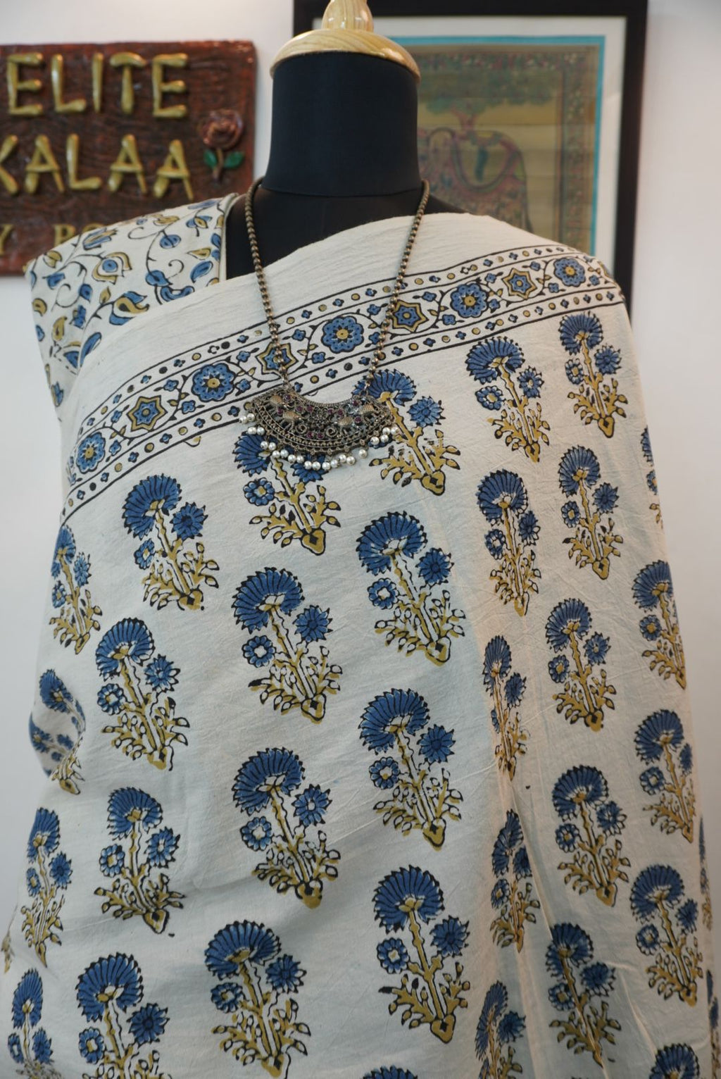 Ajrakh cotton saree in ivory with olive green and blue placement pattern, border and tassels