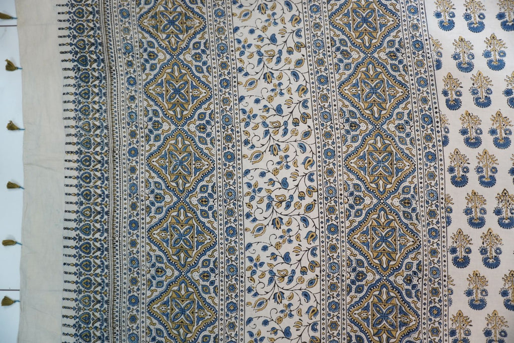 Ajrakh cotton saree in ivory with olive green and blue placement pattern, border and tassels