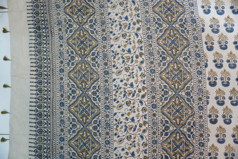 Ajrakh cotton saree in ivory with olive green and blue placement pattern, border and tassels