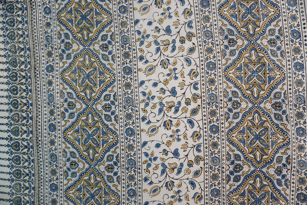 Ajrakh cotton saree in ivory with olive green and blue placement pattern, border and tassels