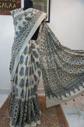 Ivory Ajrakh cotton saree with olive green and blue design, border and tassels