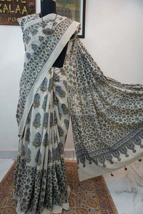 Ivory Ajrakh cotton saree with olive green and blue design, border and tassels