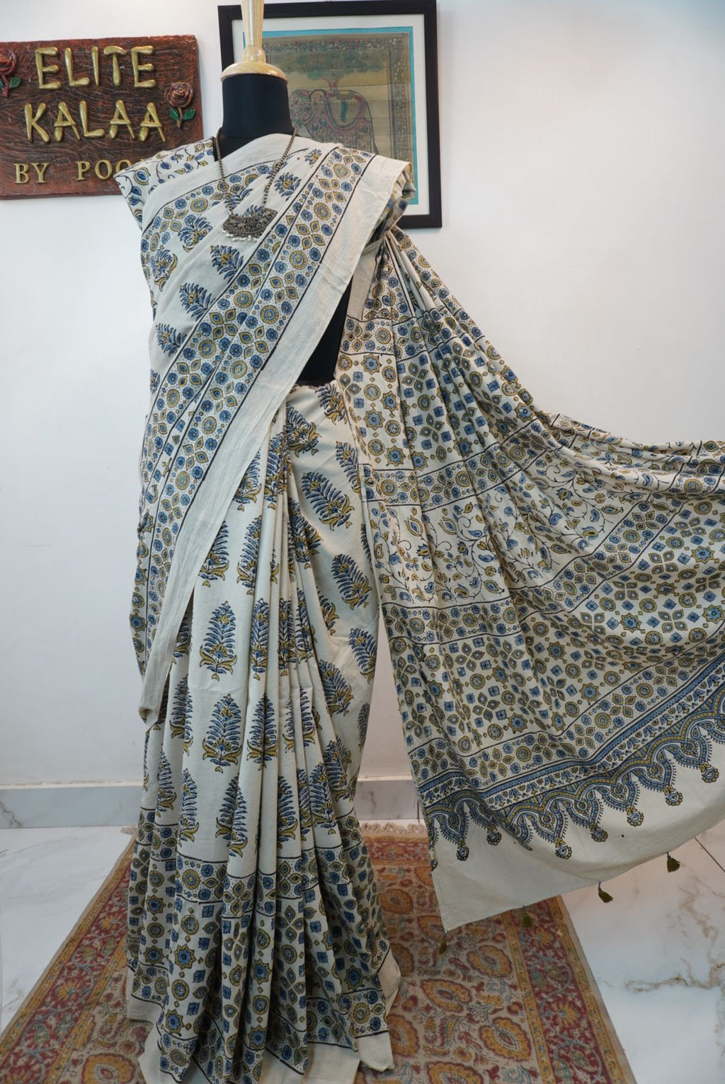 Ivory Ajrakh cotton saree with olive green and blue design, border and tassels