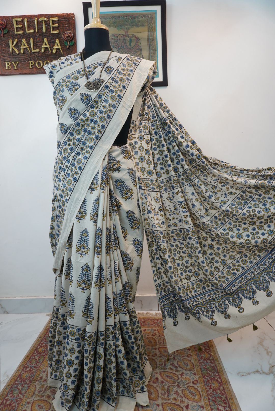 Ivory Ajrakh cotton saree with olive green and blue design, border and tassels