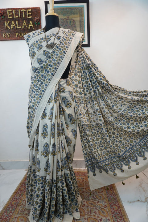 Ivory Ajrakh cotton saree with olive green and blue design, border and tassels