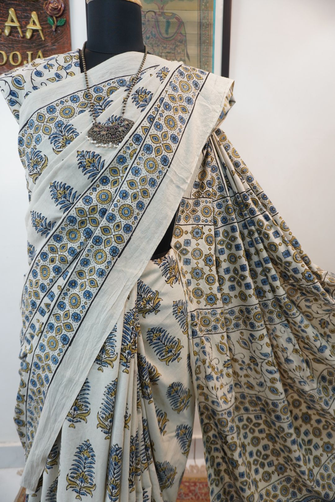 Ivory Ajrakh cotton saree with olive green and blue design, border and tassels