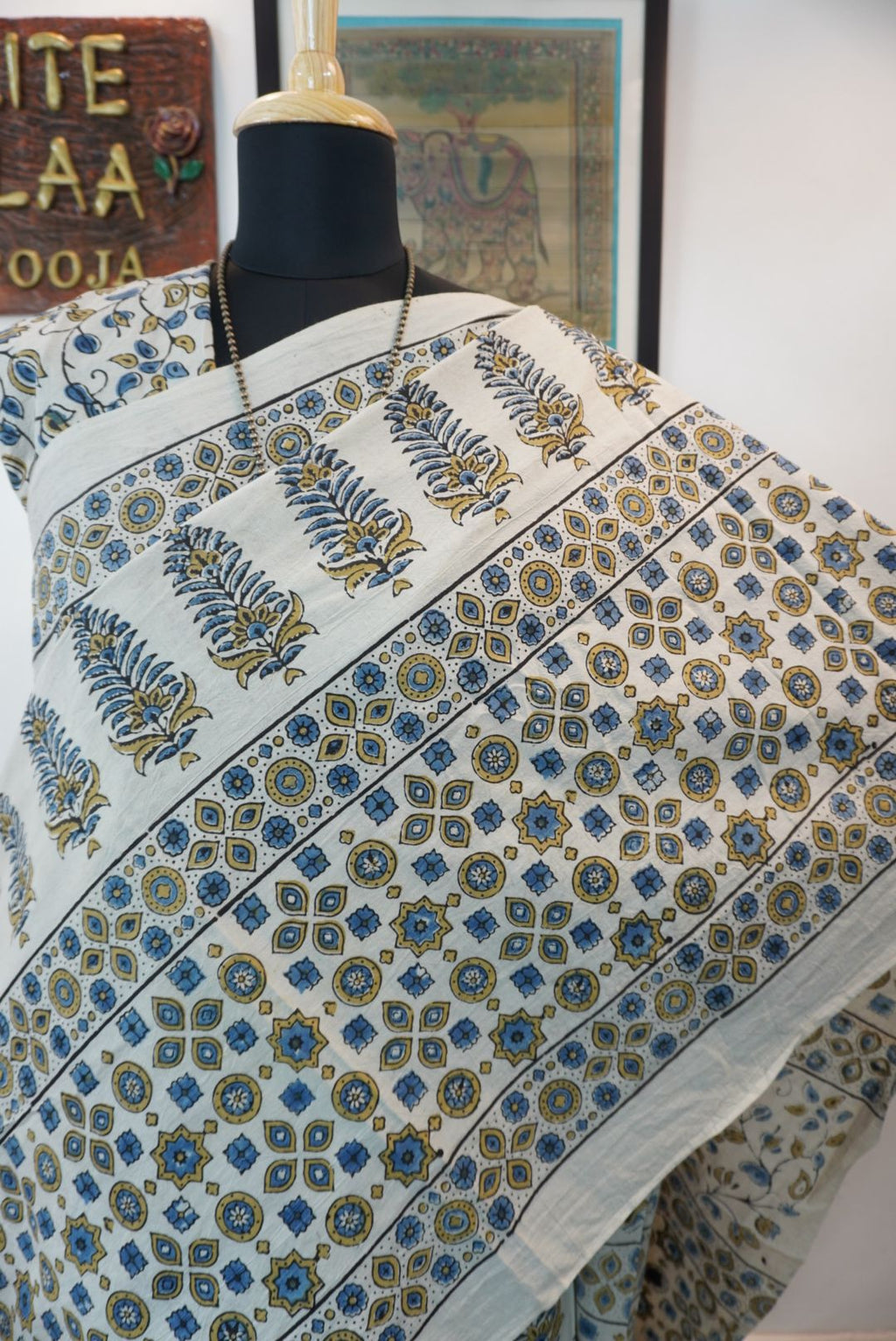 Ivory Ajrakh cotton saree with olive green and blue design, border and tassels