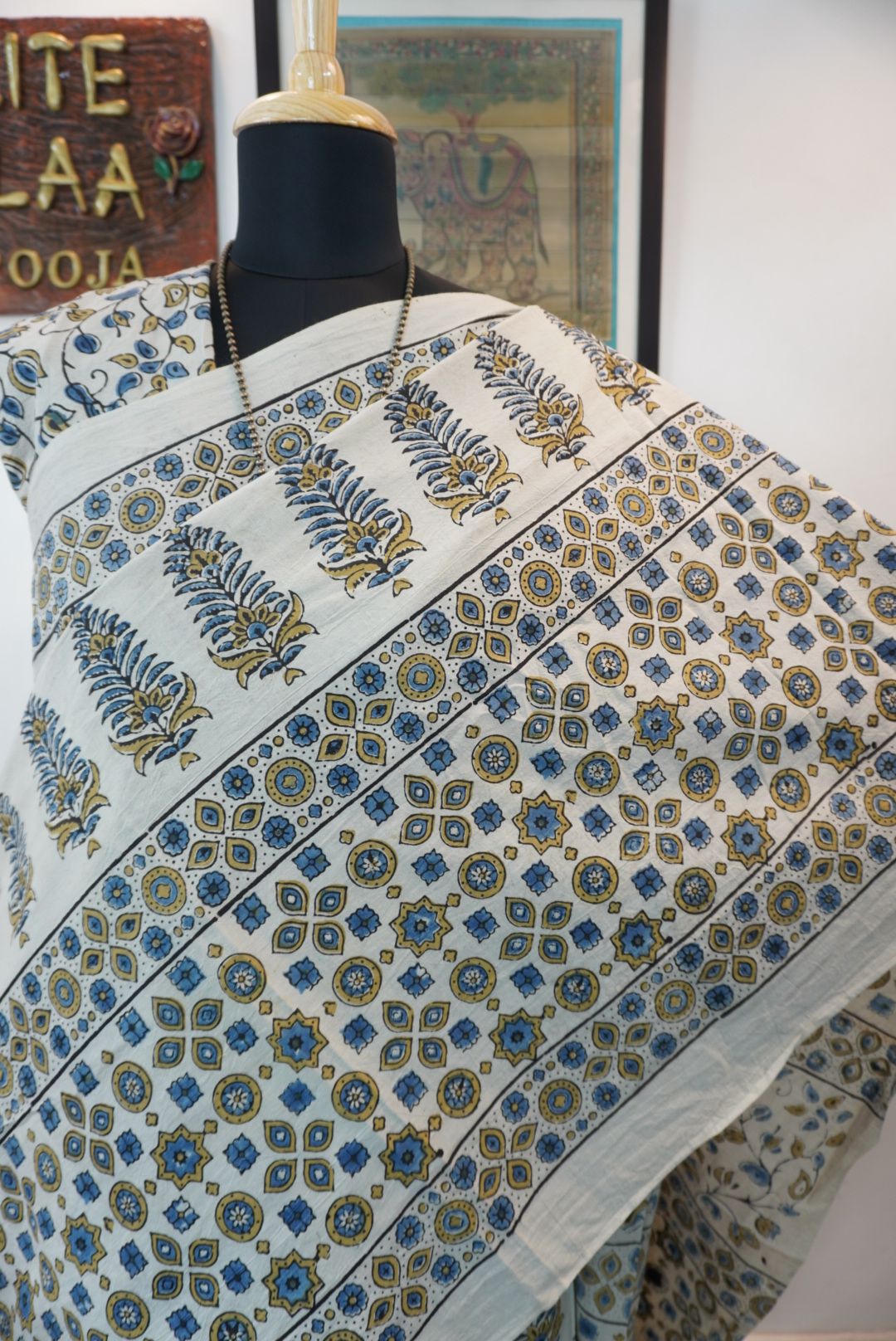 Ivory Ajrakh cotton saree with olive green and blue design, border and tassels