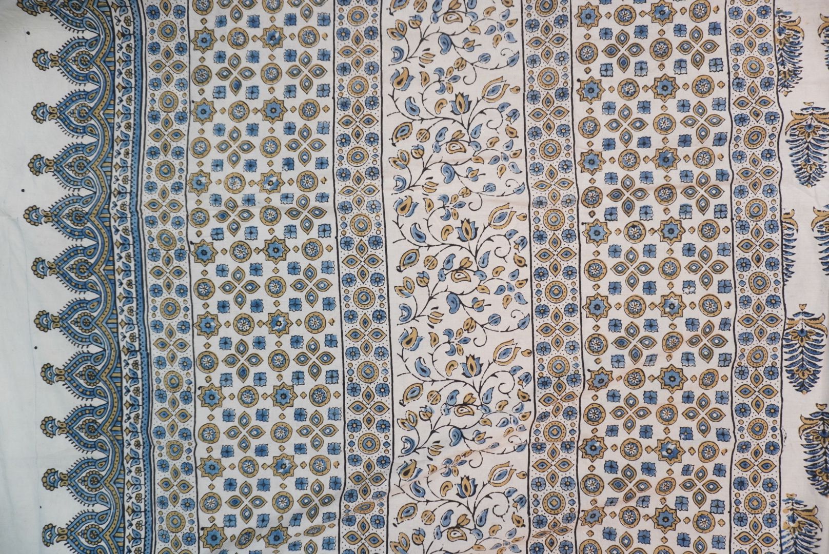 Ivory Ajrakh cotton saree with olive green and blue design, border and tassels
