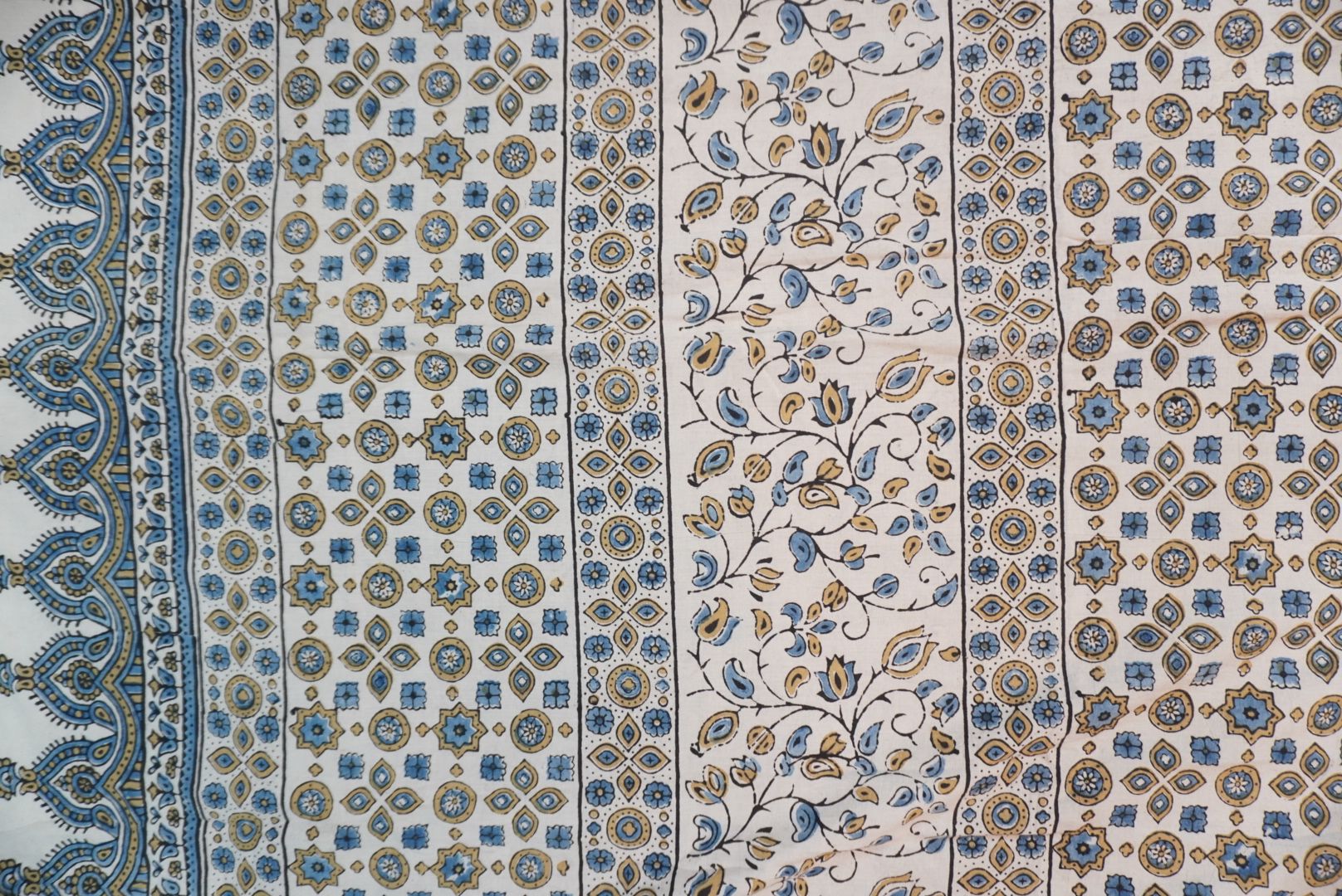 Ivory Ajrakh cotton saree with olive green and blue design, border and tassels