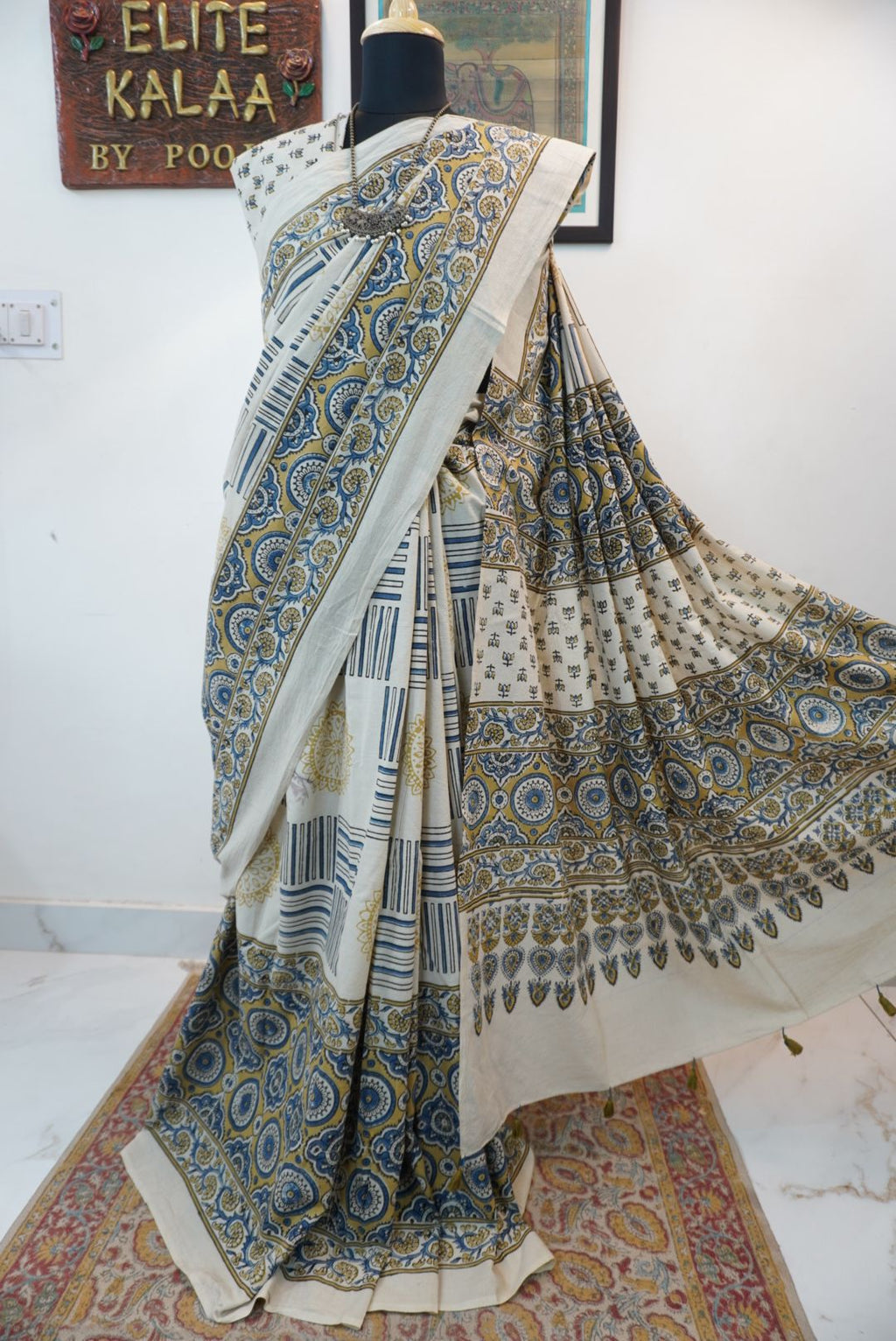 Ajrakh cotton saree in ivory with olive green and blue design and border