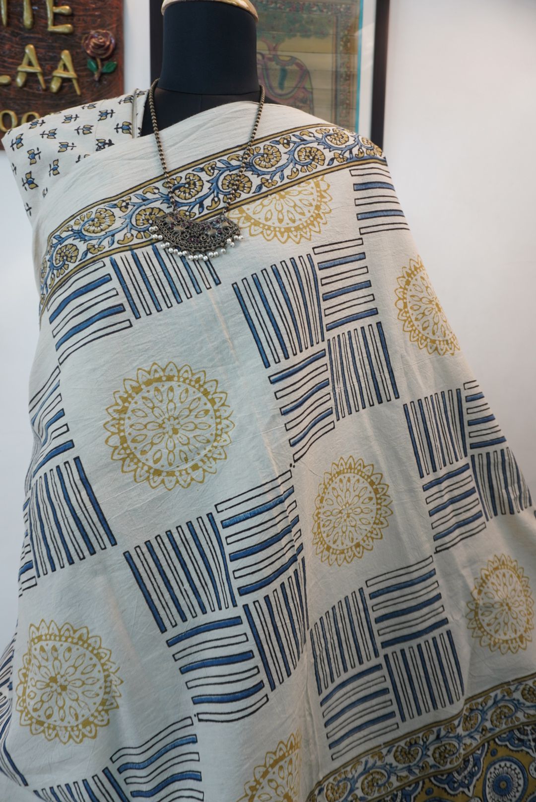 Ajrakh cotton saree in ivory with olive green and blue design and border