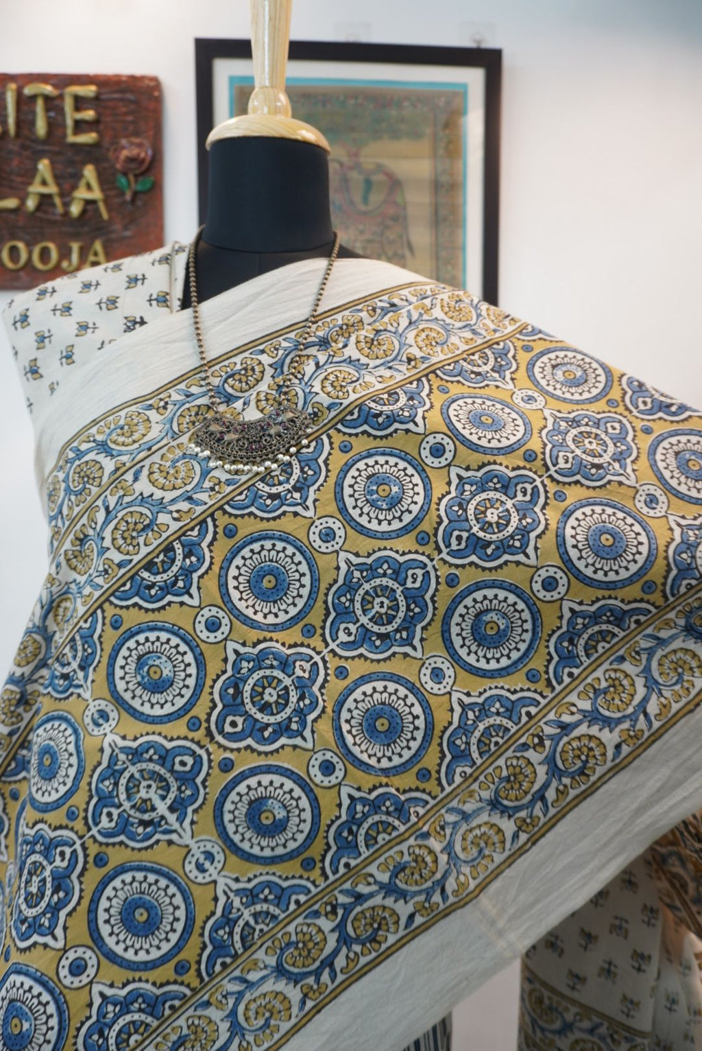 Ajrakh cotton saree in ivory with olive green and blue design and border