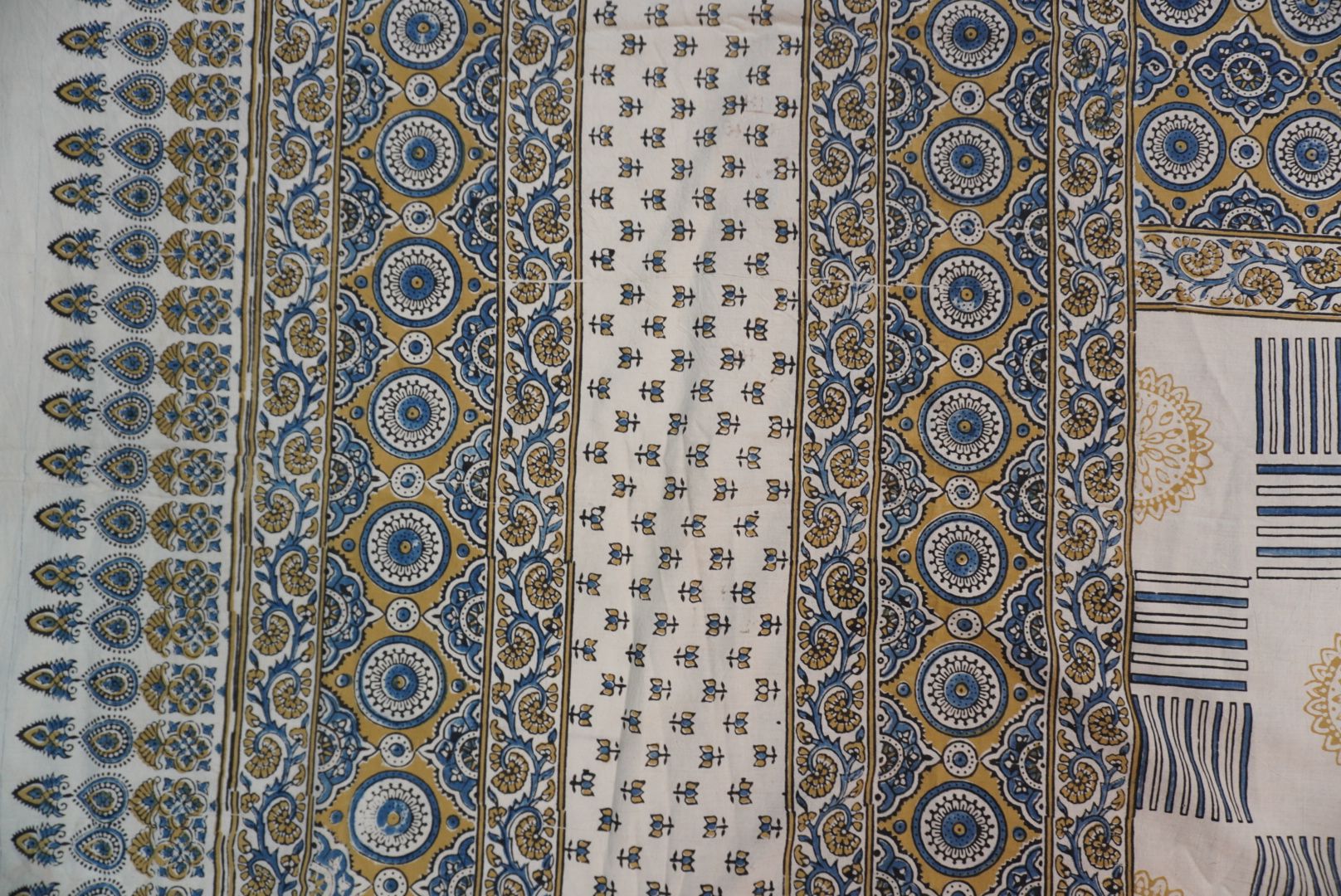 Ajrakh cotton saree in ivory with olive green and blue design and border