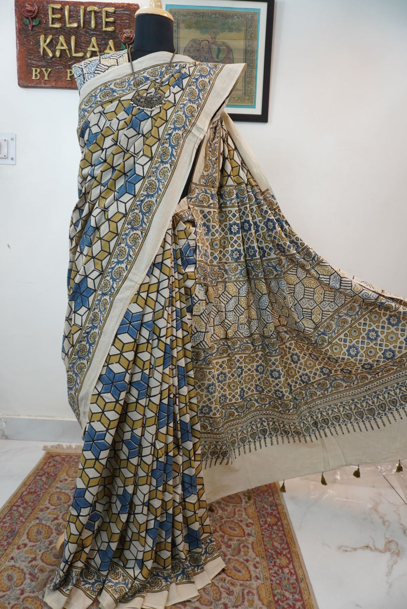 Ajrakh cotton saree in ivory with olive green, blue and yellow all-over design and border detail