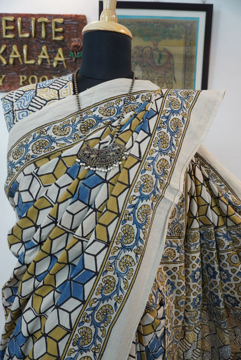 Ajrakh cotton saree in ivory with olive green, blue and yellow all-over design and border detail
