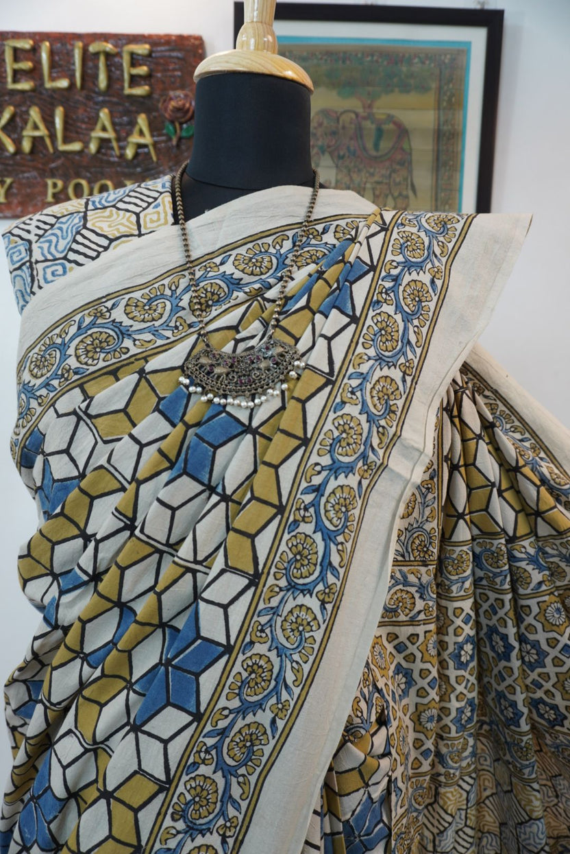 Ajrakh cotton saree in ivory with olive green, blue and yellow all-over design and border detail