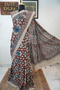 Ajrakh cotton saree in ivory with red rust and blue, all-over pattern with border and tassels