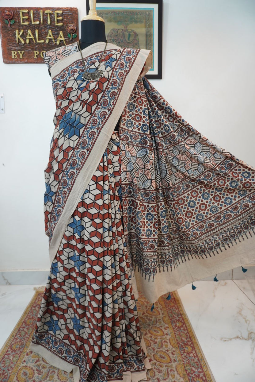 Ajrakh cotton saree in ivory with red rust and blue, all-over pattern with border and tassels