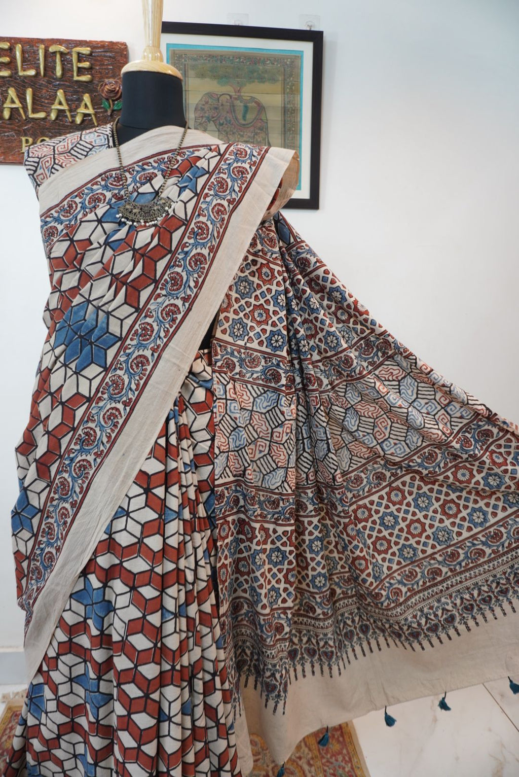 Ajrakh cotton saree in ivory with red rust and blue, all-over pattern with border and tassels