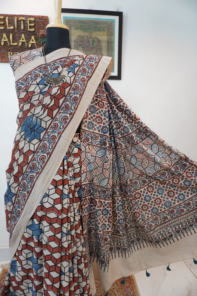 Ajrakh cotton saree in ivory with red rust and blue, all-over pattern with border and tassels