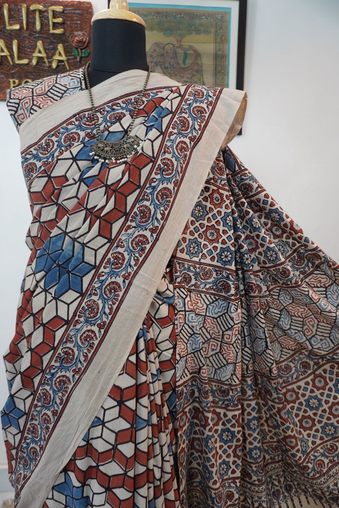 Ajrakh cotton saree in ivory with red rust and blue, all-over pattern with border and tassels