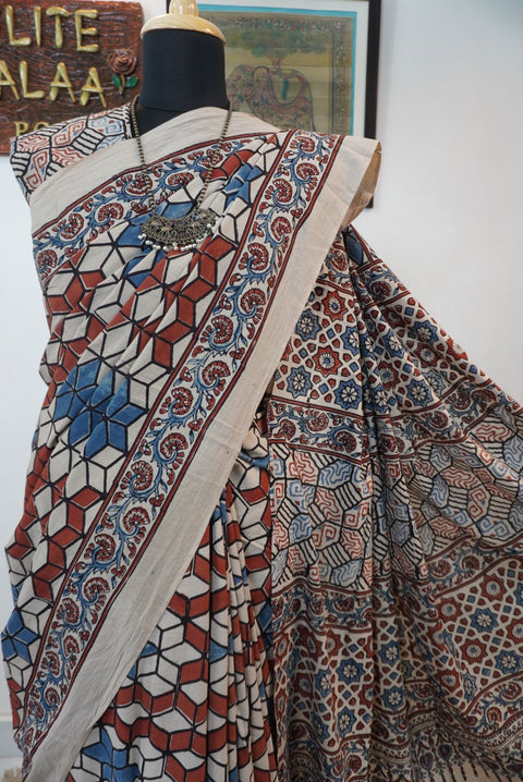Ajrakh cotton saree in ivory with red rust and blue, all-over pattern with border and tassels