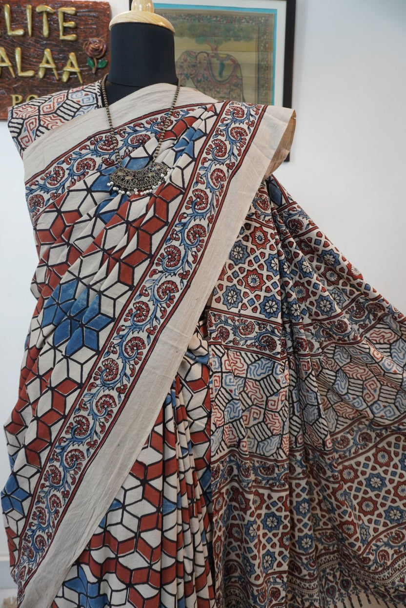 Ajrakh cotton saree in ivory with red rust and blue, all-over pattern with border and tassels
