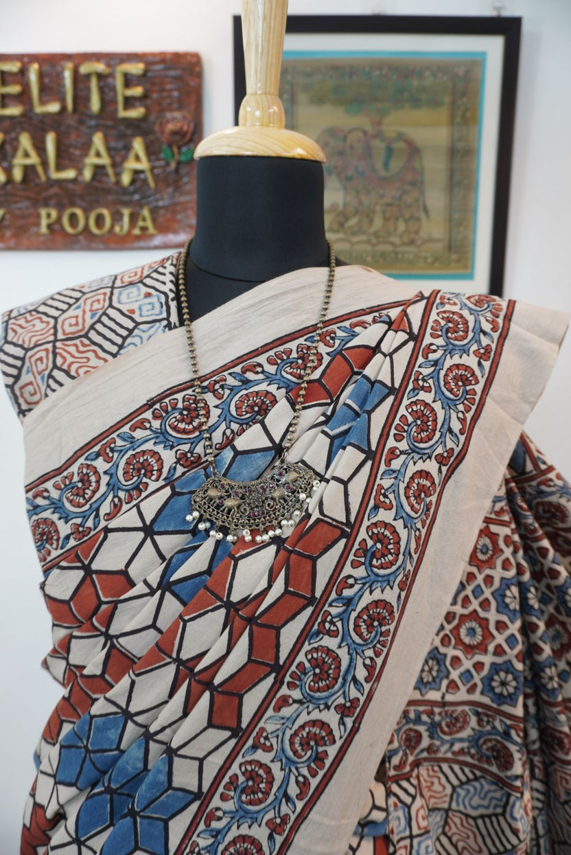 Ajrakh cotton saree in ivory with red rust and blue, all-over pattern with border and tassels