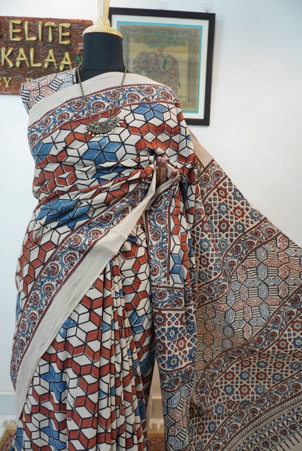 Ajrakh cotton saree in ivory with red rust and blue, all-over pattern with border and tassels