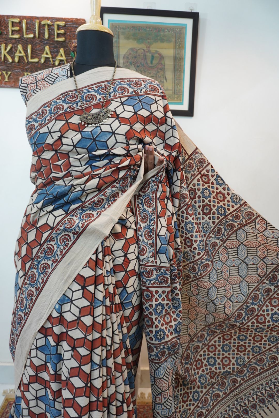 Ajrakh cotton saree in ivory with red rust and blue, all-over pattern with border and tassels