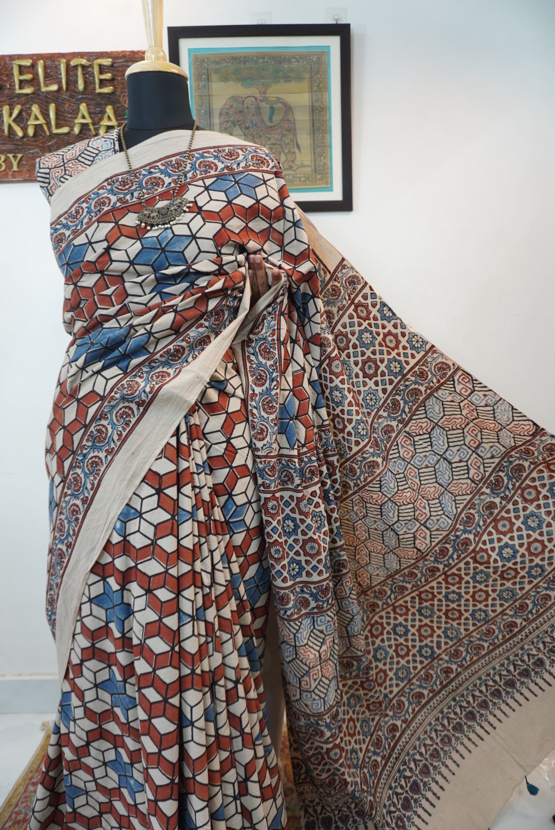 Ajrakh cotton saree in ivory with red rust and blue, all-over pattern with border and tassels
