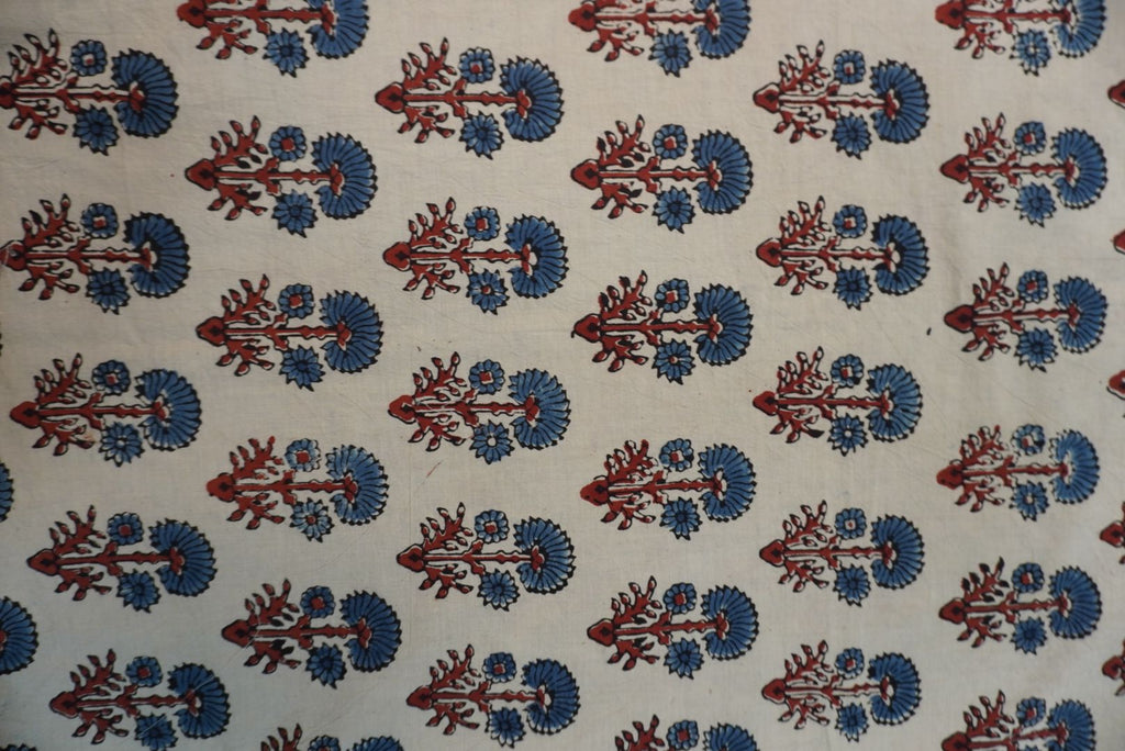 Ivory Ajrakh cotton saree with red rust and blue placement pattern, border and tassels
