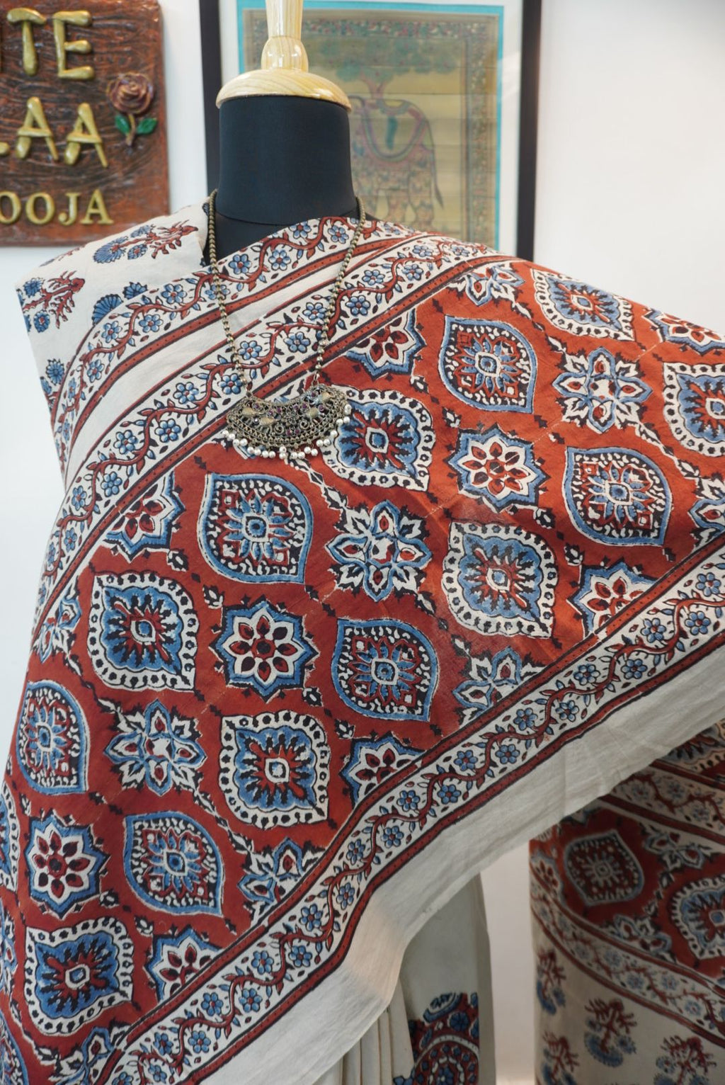 Ivory Ajrakh cotton saree with red rust and blue placement pattern, border and tassels