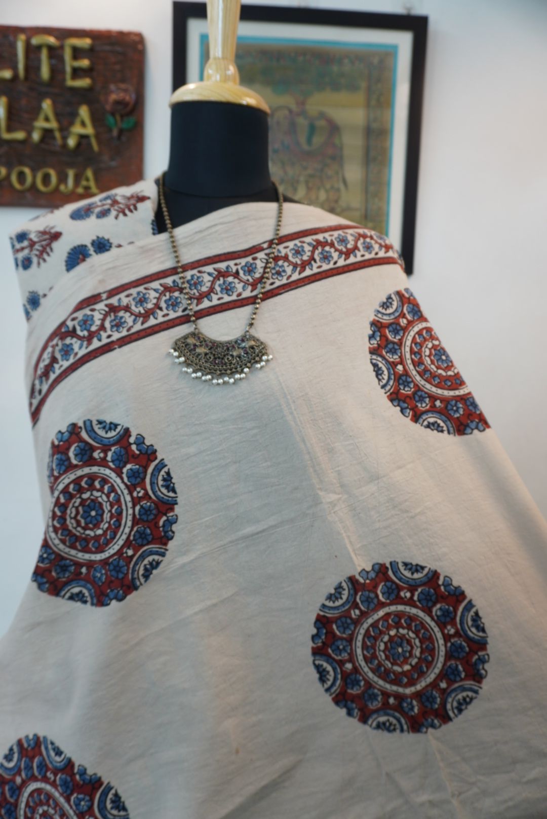 Ivory Ajrakh cotton saree with red rust and blue placement pattern, border and tassels