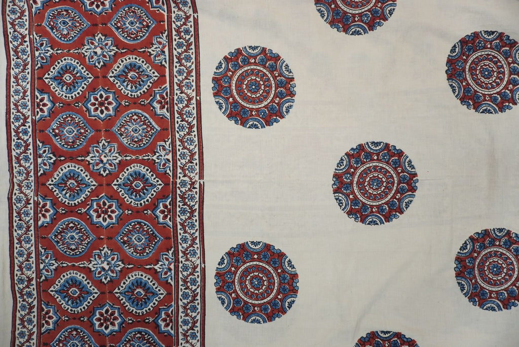 Ivory Ajrakh cotton saree with red rust and blue placement pattern, border and tassels