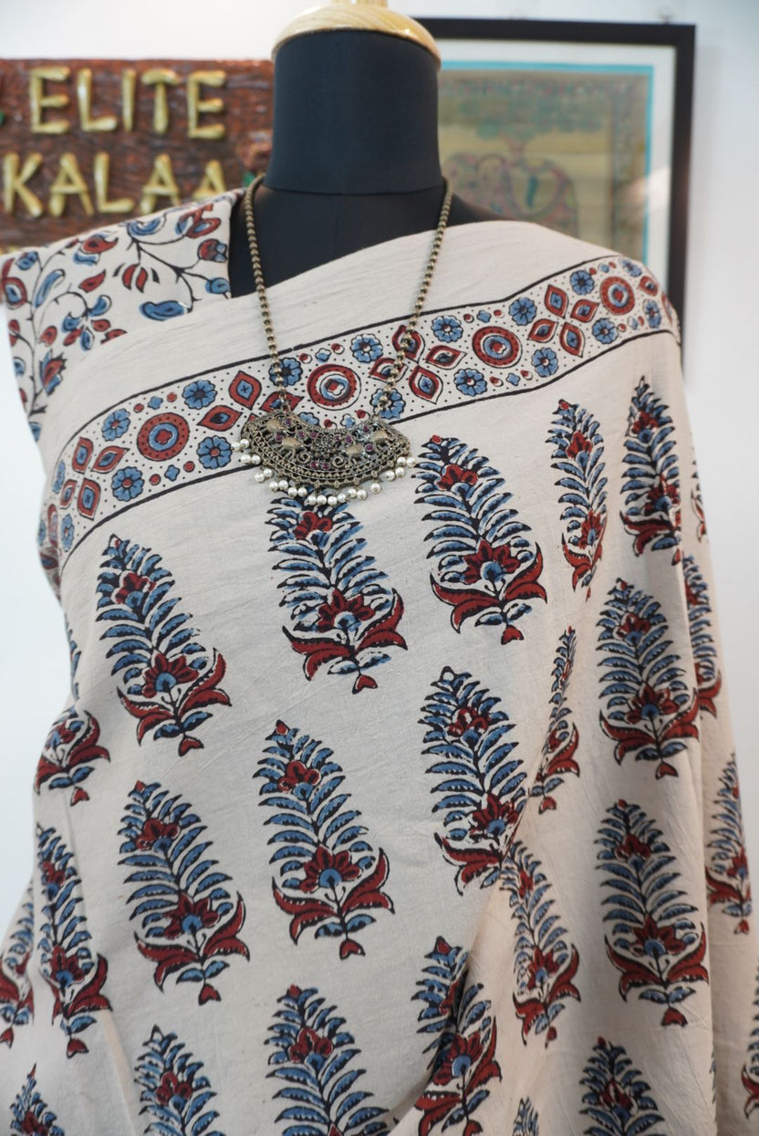 Cotton Ajrakh saree in ivory with red rust and blue, all-over pattern, border and tassels