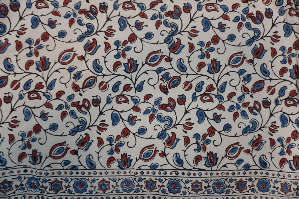 Ivory cotton Ajrakh saree with red, blue and rust placement pattern, border and tassels