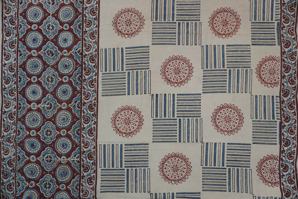 Ajrakh cotton saree in ivory with red rust and blue all-over pattern, border and tassels