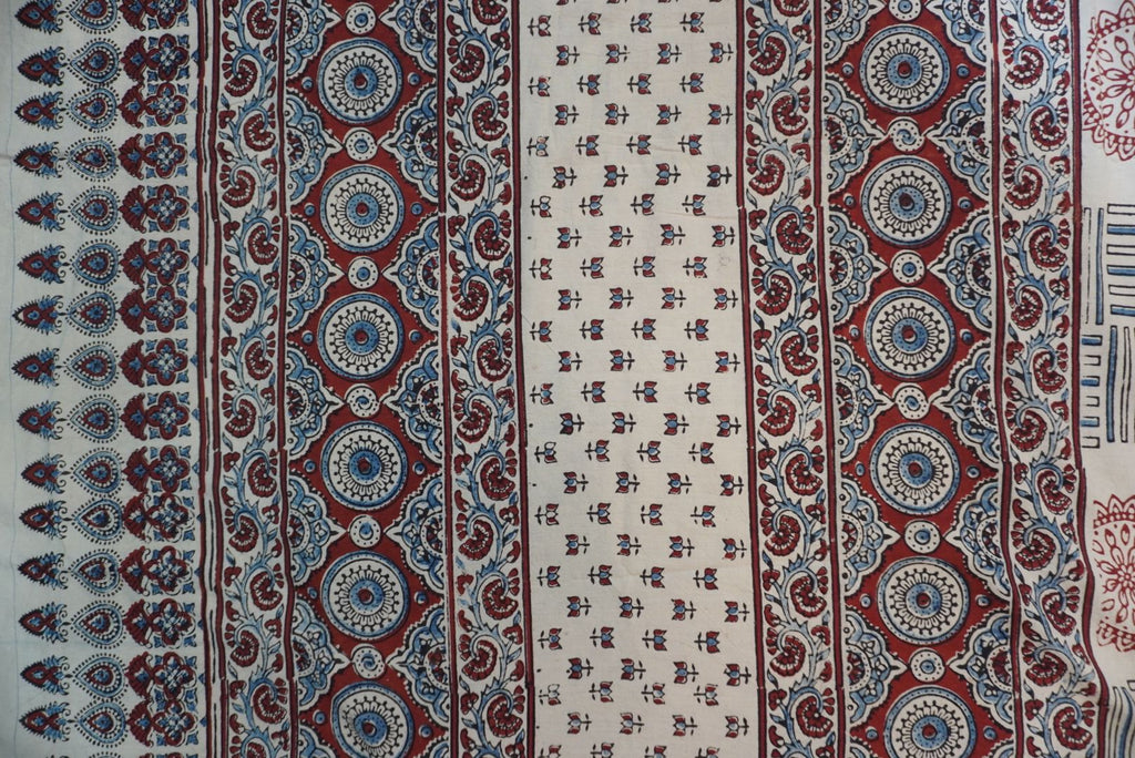 Ajrakh cotton saree in ivory with red rust and blue all-over pattern, border and tassels