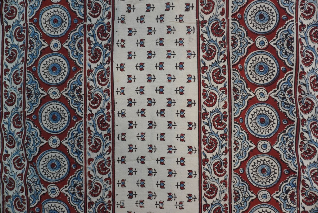 Ajrakh cotton saree in ivory with red rust and blue all-over pattern, border and tassels